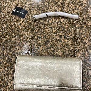 This is a new INC. shoulder purse. Multiple pockets inside.